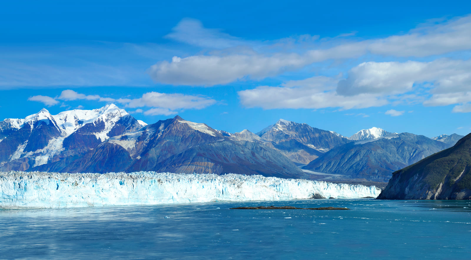 A tidewater glacier meeting the sea in Alaska