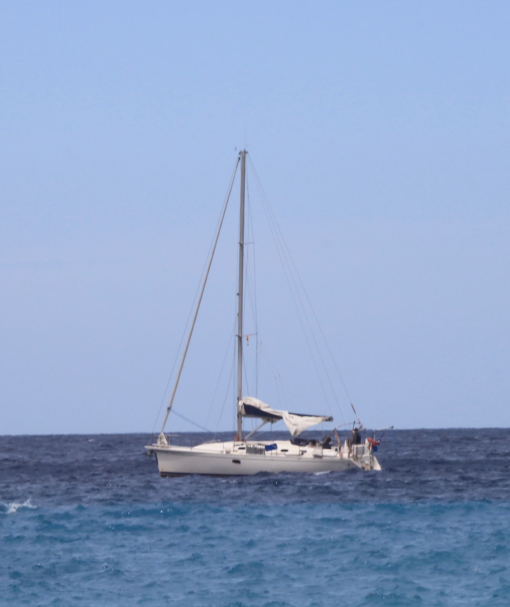 A sailboat on open blue water